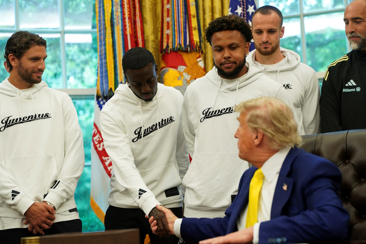 U.S. President Donald Trump shakes hands with a player of the Juventus soccer team in the Oval Office of the White House in Washington, D.C., U.S., June 18, 2025. REUTERS