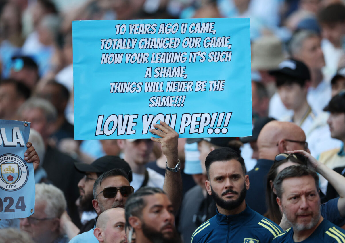 Soccer Football - Premier League - Manchester City v Aston Villa - Etihad Stadium, Manchester, Britain - May 24, 2026 Manchester City fan holds a sign for manager Pep Guardiola in the stands before the match REUTERS