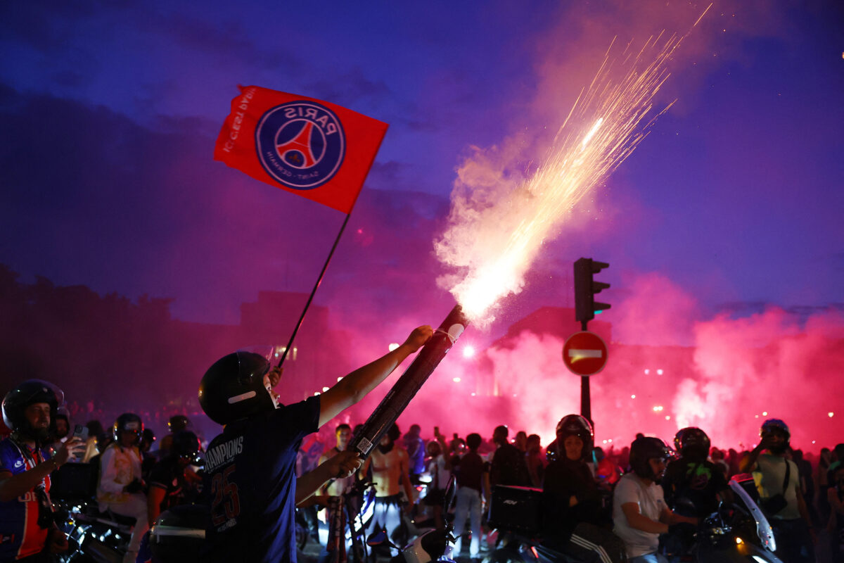 Soccer Football - UEFA Champions League - Paris St Germain fans celebrate winning the UEFA Champions League - Trocadero, Paris, France - May 30, 2026 Paris St Germain fans celebrate with flares after winning the UEFA Champions League REUTERS